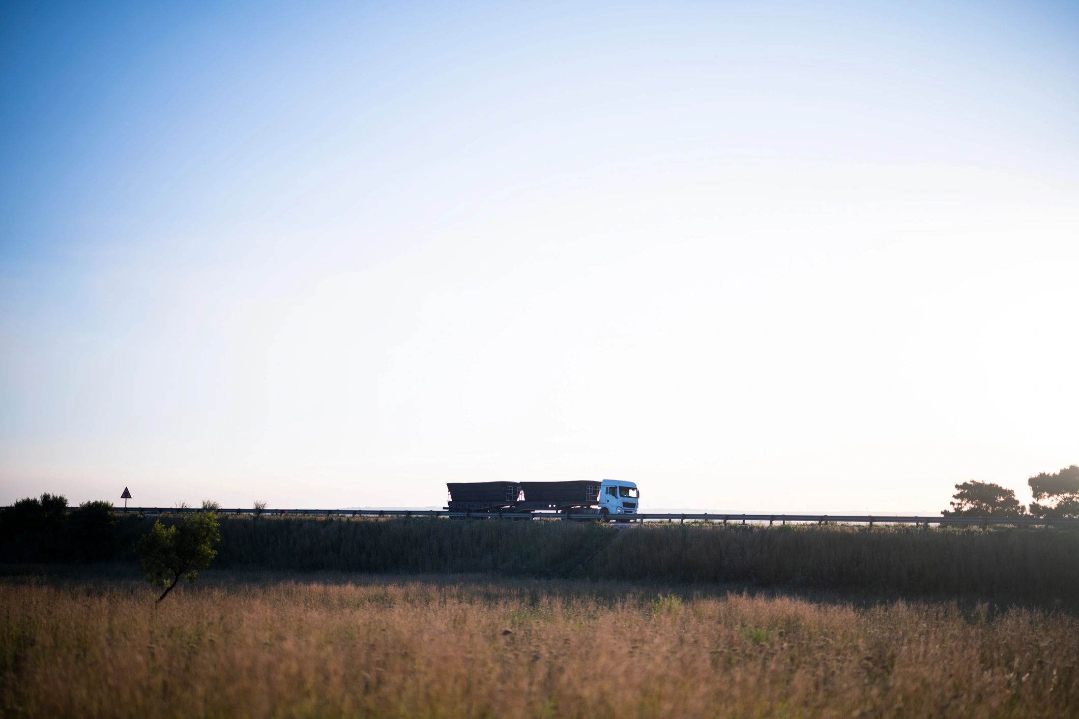 Curtain-side freight truck on a South African highway